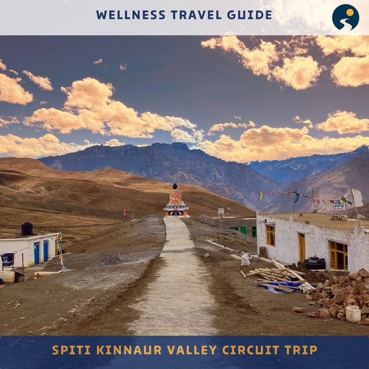 Wellness travel guide for Spiti Kinnaur Valley Circuit Trip with mountainous landscape and buildings.
